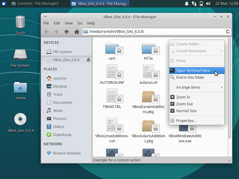 Screenshot of the File Manager showing the Guest Additions disc contents. With the mouse hovering over "Open Terminal Here" in the right-click context menu.
